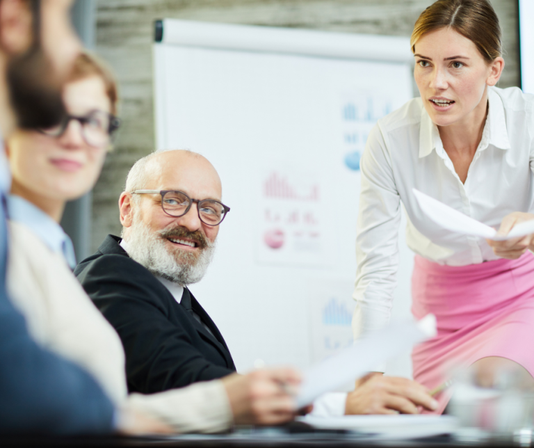 Team discussion during a workplace meeting, exploring different viewpoints and showing how conflict can be positive when managed constructively.