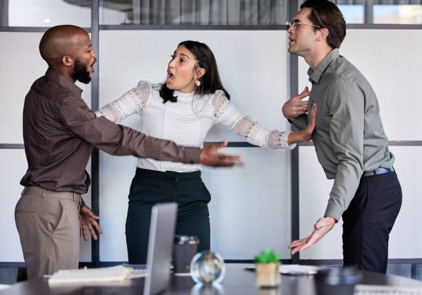 Team practicing DiSC conflict resolution strategies during productive workplace disagreement