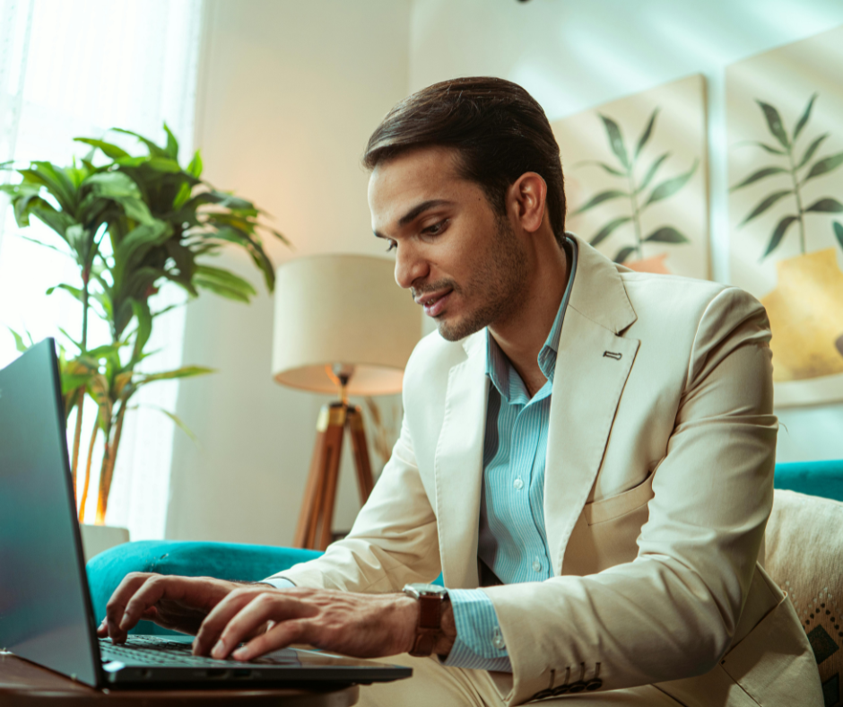 Business leader working from home on a laptop, demonstrating how to lead a remote team with focus and clear communication.